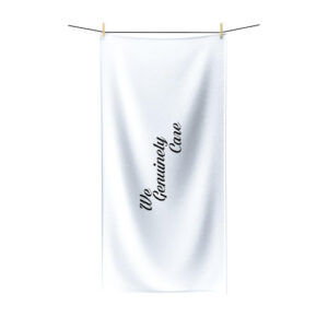 A white towel hanging on a clothes line.