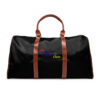 A black duffel bag with brown handles and a rainbow colored logo.