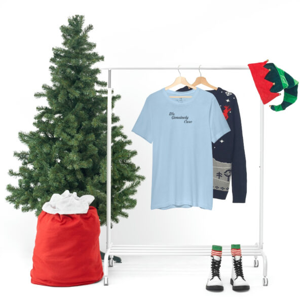 A clothes rack with some shirts and a tree