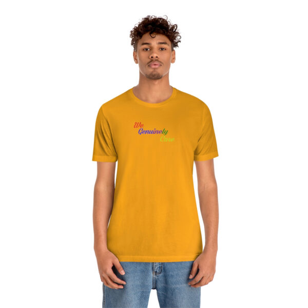 A man wearing a yellow t-shirt with the word " namaste ".