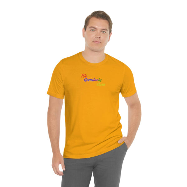 A man wearing a yellow t-shirt with the word " namaste ".