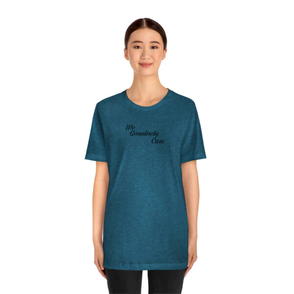 A woman wearing a blue t-shirt with the word " serendipity ".