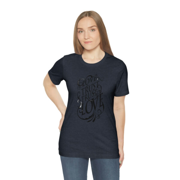 A woman wearing a black t-shirt with an octopus design.