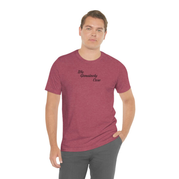 A man wearing a maroon t-shirt with the words " mommy time ".