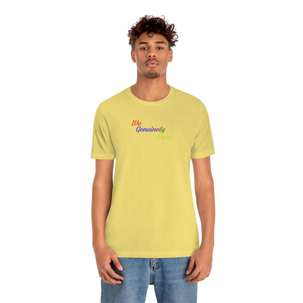 A man wearing a yellow t-shirt with the word " positivity ".