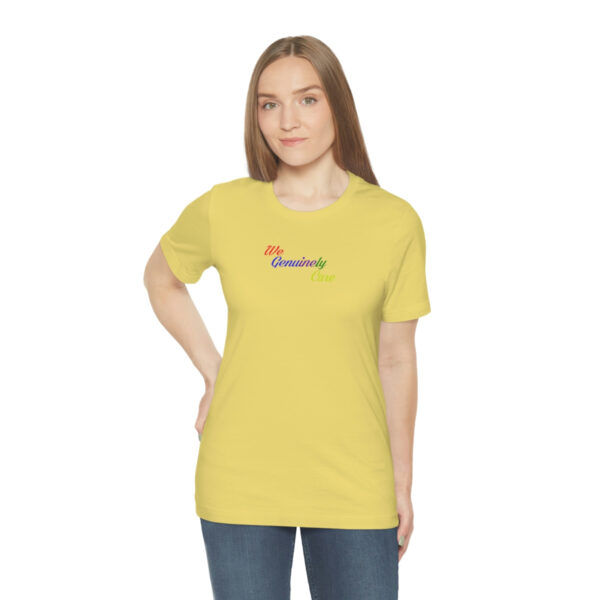 A woman wearing a yellow t-shirt with the word " namaste ".