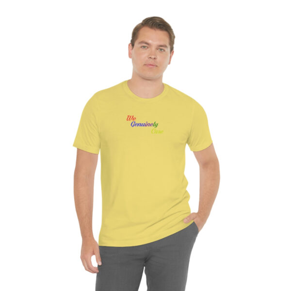 A man wearing a yellow t-shirt with the word " namaste ".