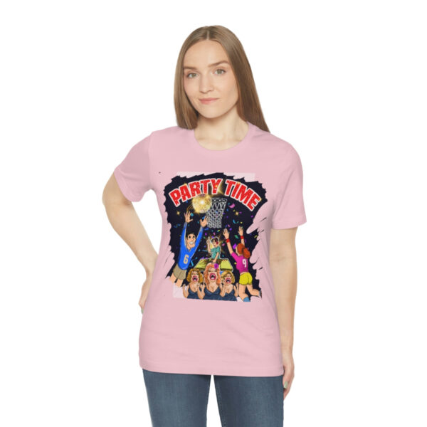 A woman wearing a pink t-shirt with a cartoon of people.