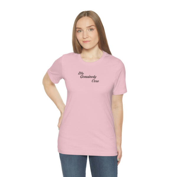 A woman wearing a pink t-shirt with the words " mommy 's day ".