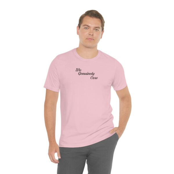 A man wearing a pink t-shirt with the words " my mommy 's name ".