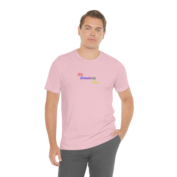 A man wearing a pink t-shirt with the word " grandma ".