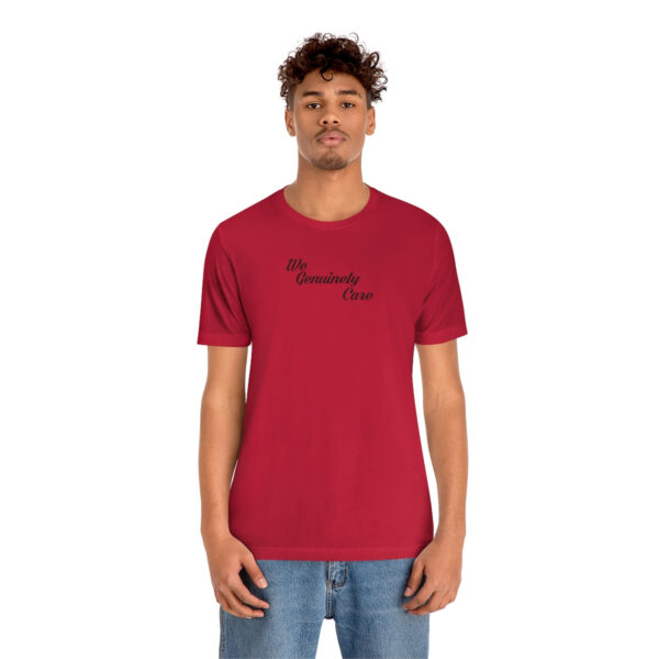 A man wearing a red t-shirt with the words " sincerely, yours ".