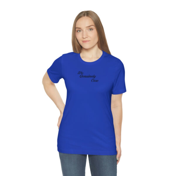 A woman wearing a blue t-shirt with the words " i am someone 's only."