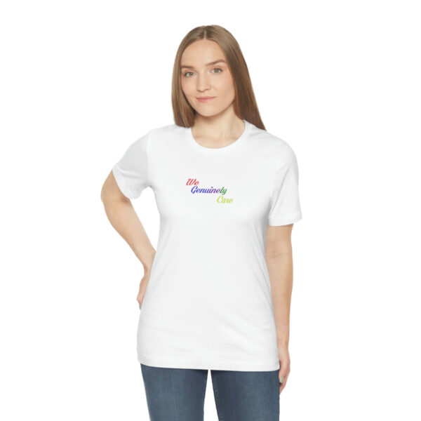 A woman wearing a white t-shirt with the word " rainbow ".