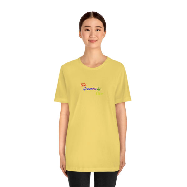 A woman wearing a yellow t-shirt with the word " somewhere ".