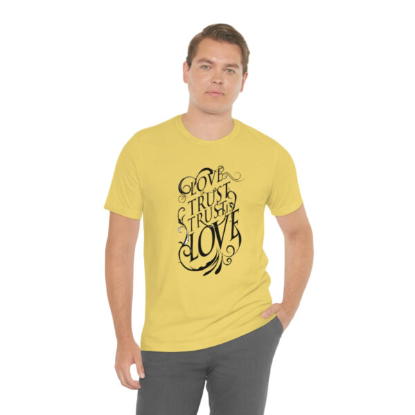 A man wearing a yellow t-shirt with the words " god is true."