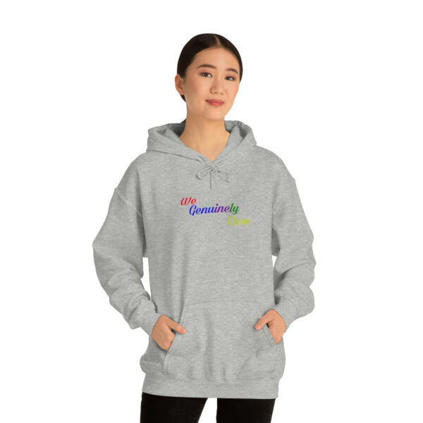 A woman wearing a gray hoodie with the word " equality ".