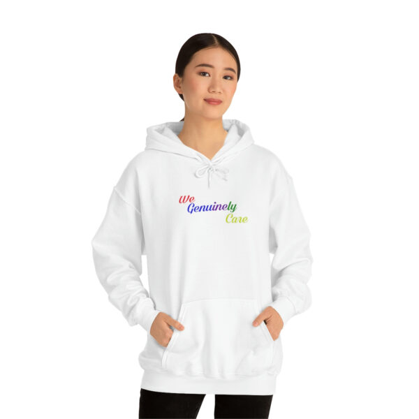 A woman wearing a white hoodie with the words " equality now ".