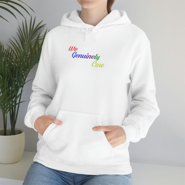 A woman is wearing a white hoodie with the words " my community chest ".