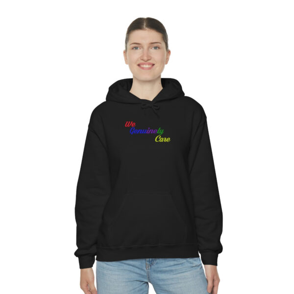 A woman wearing a black hoodie with the words " be yourself " on it.