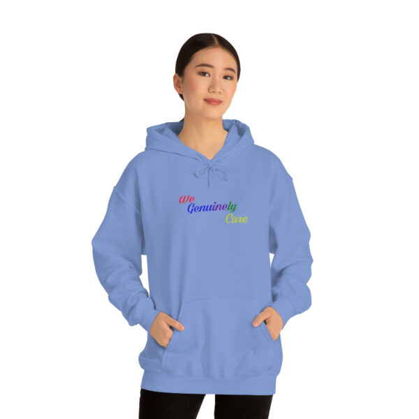 A woman in blue hoodie with the words " grandma 's girl ".