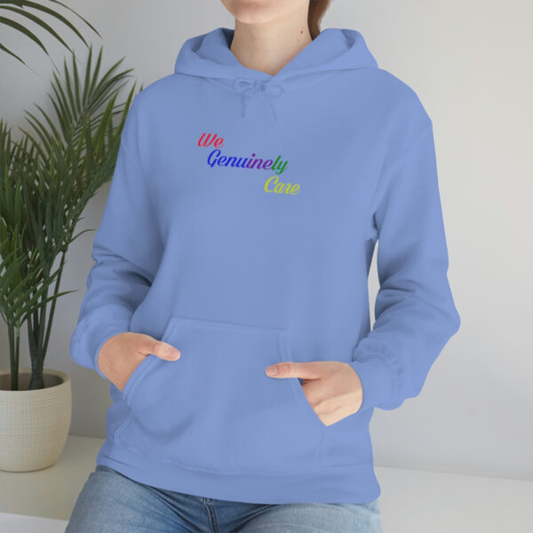 A woman is wearing a blue hoodie with the words " somebody else ".