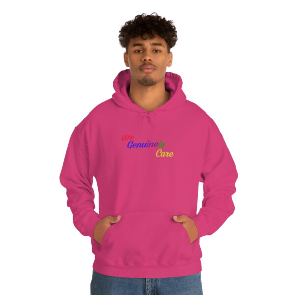 A man in a pink hoodie with the words " powered by " on it.