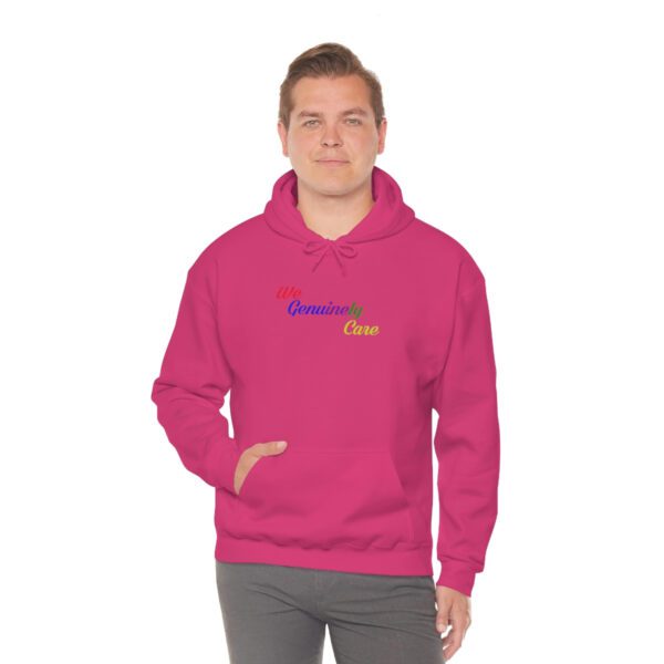 A man in a pink hoodie with the words " powered by " on it.