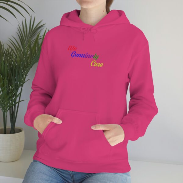 A woman is wearing a pink hoodie with the words " grandma 's girl ".