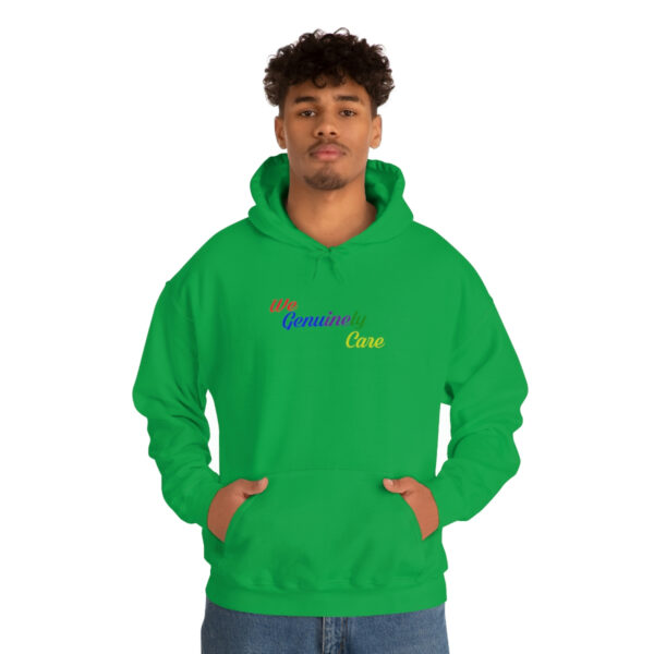 A man in a green hoodie with the word " inspire " on it.