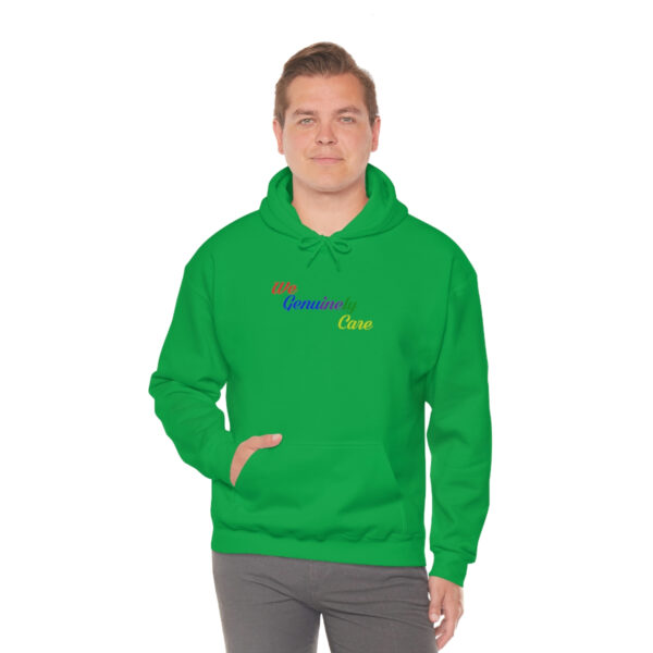 A man in a green hoodie is standing up