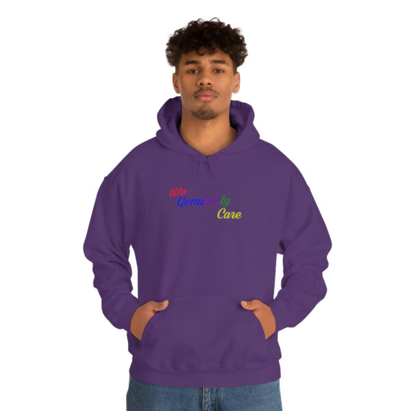 A man in purple hoodie with rainbow logo