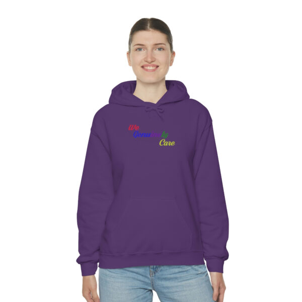 A woman wearing a purple hoodie with the word " live " on it.