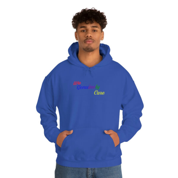 A man in blue hoodie with rainbow logo