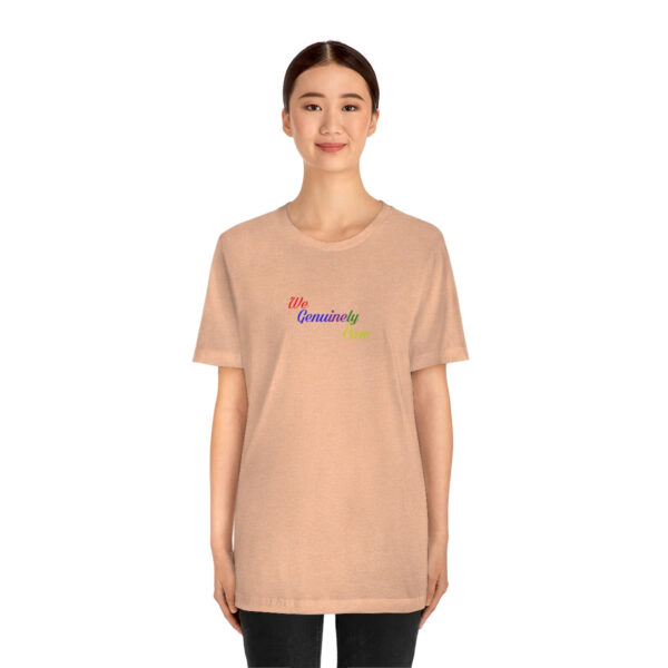 A woman wearing a t-shirt with the word " rainbow ".