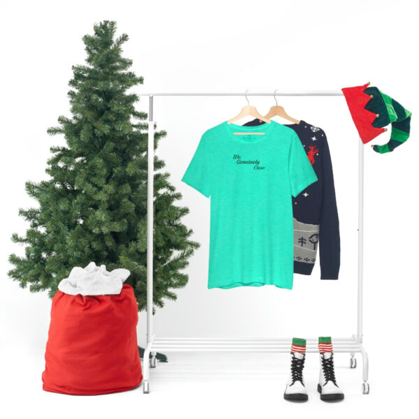 A clothes rack with some shirts and a tree