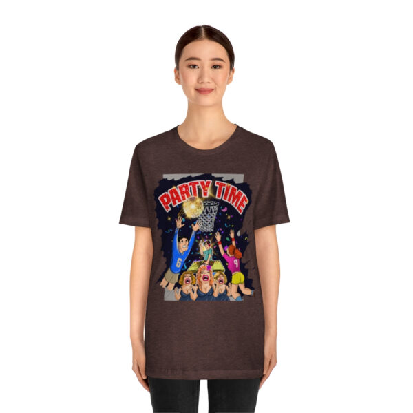 A woman wearing a brown t-shirt with a cartoon of the beatles