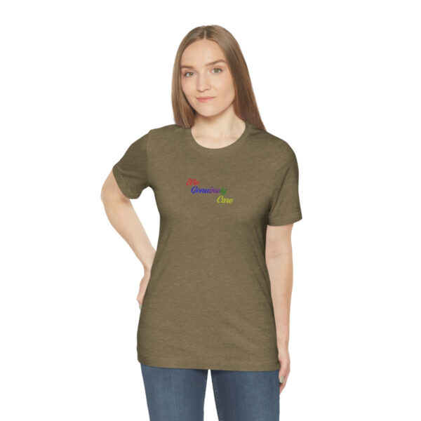 A woman wearing a brown t-shirt with the word " denver " on it.