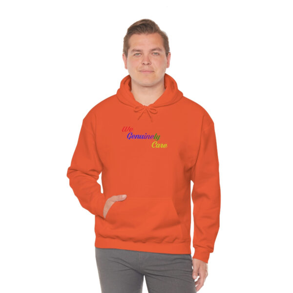 A man in an orange hoodie with the word " rainbow ".