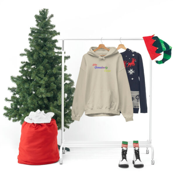 A clothes rack with a christmas tree and some clothing.