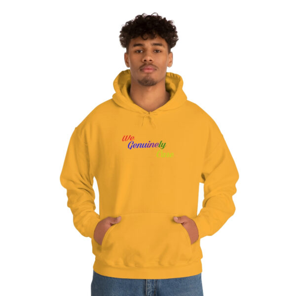 A man in a yellow hoodie with the word " rainbow ".