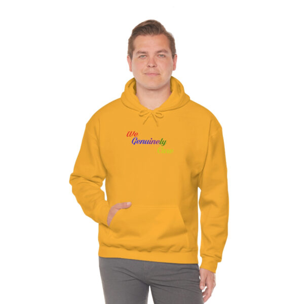 A man in a yellow hoodie is standing up