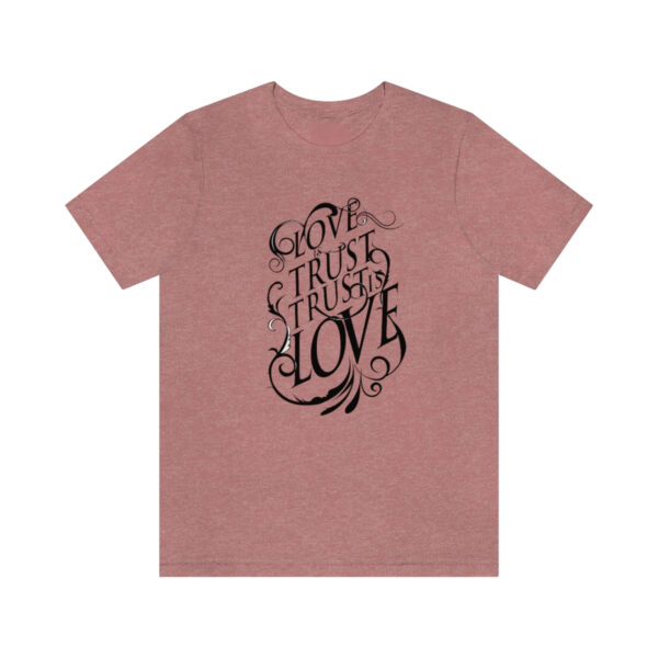 A pink t-shirt with the words " god trust us to do love ".