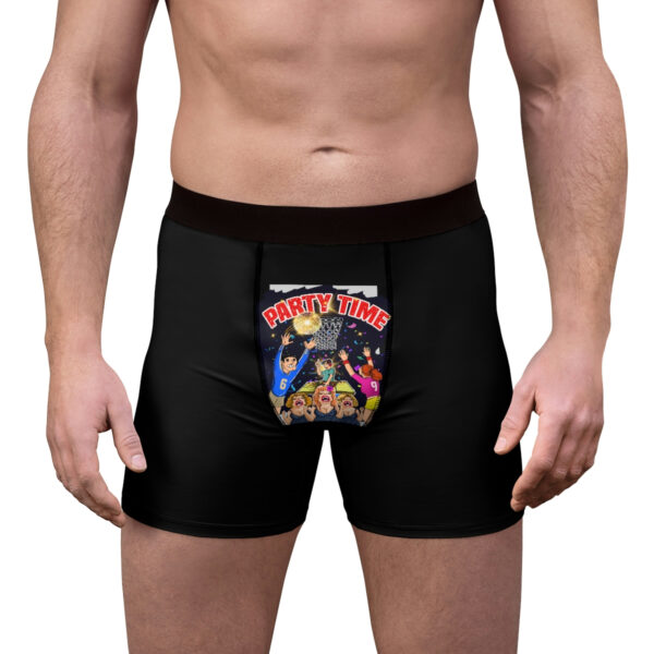 A man wearing black boxers with a cartoon of a woman and child.