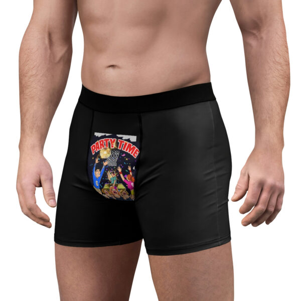 A man wearing black boxers with a picture of the power rangers.