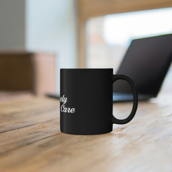 A coffee mug sitting on top of a wooden table.