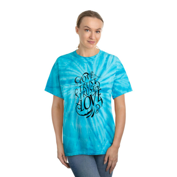 A woman wearing a blue tie dye t-shirt.