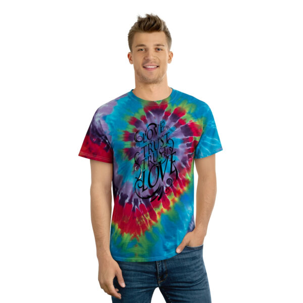 A man wearing a tie dye t shirt.