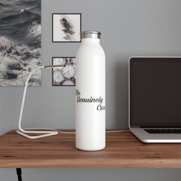 A white water bottle sitting on top of a wooden table.