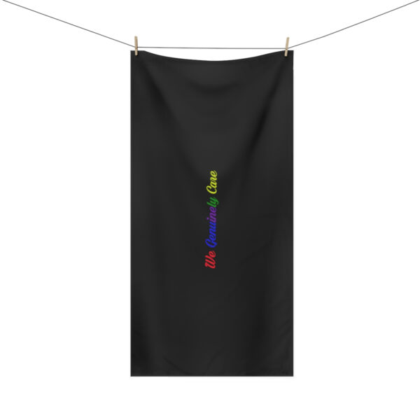 A black towel with the word " love " written in rainbow colors.